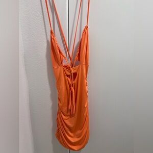 New orange open back dress